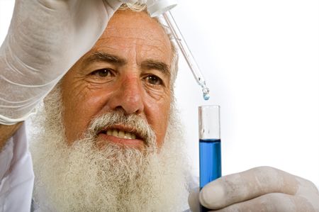 Mature scientist in laboratory holiding pipette and test tube with blue liquid isolated on whiteの写真素材