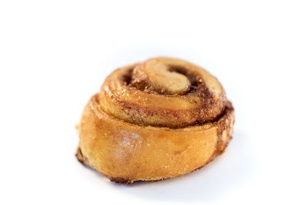 cinnamon bun isolated on white の写真素材
