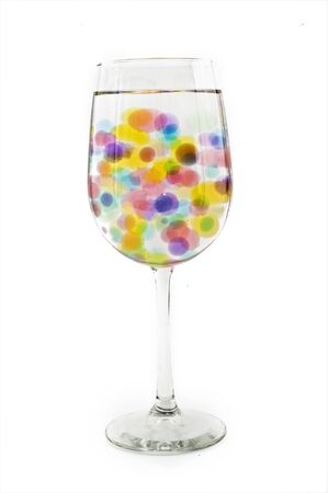 wine glass with colored bubblesの写真素材