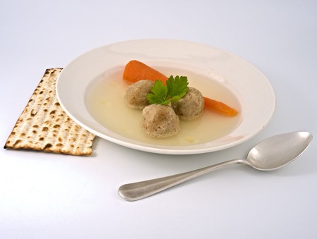 traditional passover matzo ball soup with spone and matza.の写真素材