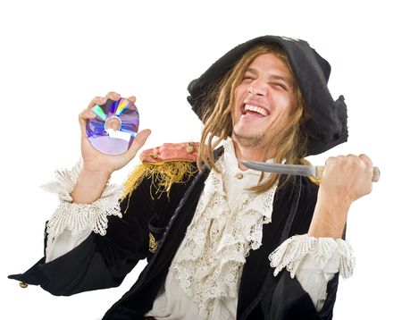 pirate aiming a knife at CDの写真素材