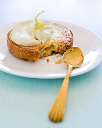 partly eated lemon tartの写真素材
