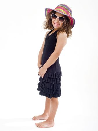 young girl with hat and sunglasses isolated on whiteの写真素材