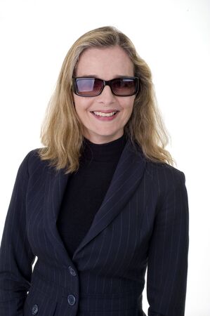 Smiling European business women in her 40's wearing sunglasses isolated on whiteの写真素材