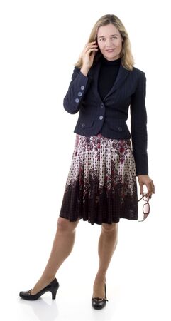 Smiling European business women with sunglasses and cell phone isolated on whiteの写真素材