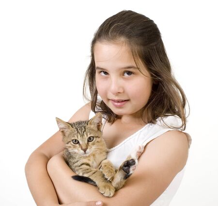little girl holding a kitten isolated on whiteの写真素材