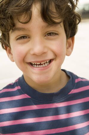close up portrait of a smiling kid の写真素材