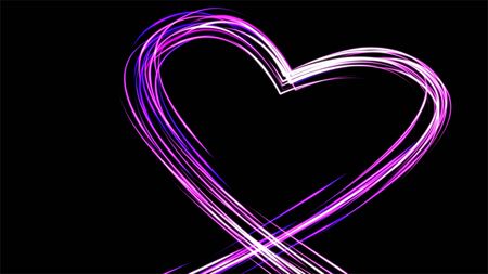 Heart silhouette painted rough brush. Light painting of pink heart on black background.の写真素材