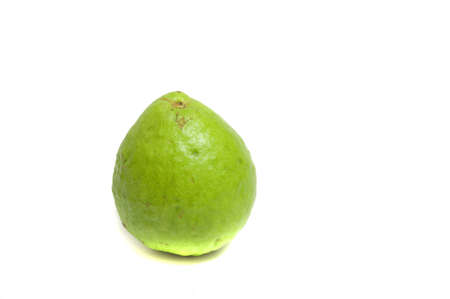 close up on a fresh organic guava, isolated on whiteの写真素材