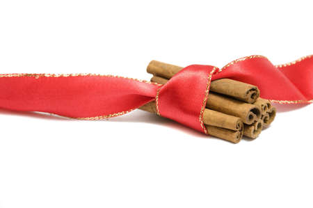 close-up on arrangement of cinnamon rolls and red ribbon, isolated on white, copy spaceの写真素材