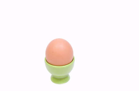 fresh chicken egg in a supportの写真素材