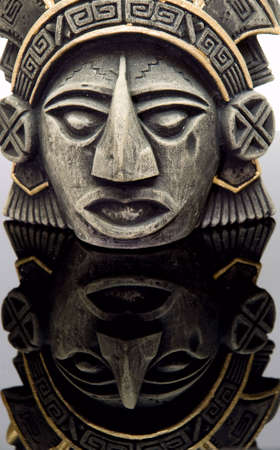 mayan mask close-up, reflected on a neutral surfaceの写真素材