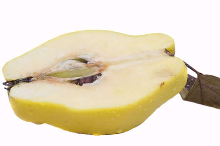 half of fresh organic quince, isolated on whiteの写真素材