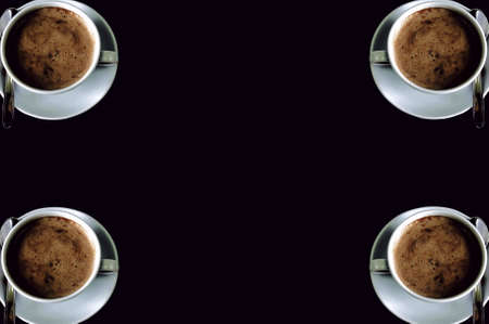 clean black background with capuccino cups in corners, isolatedの写真素材