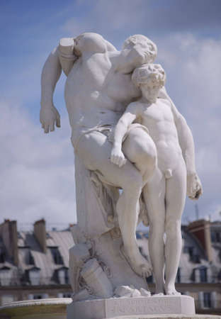 white rock statue in a parisian parkの写真素材