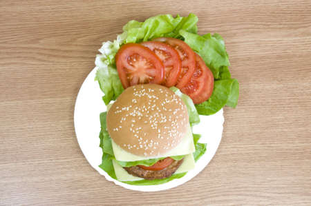 delicious beaf burger with cheese, lettuce, tomato and mayoの写真素材