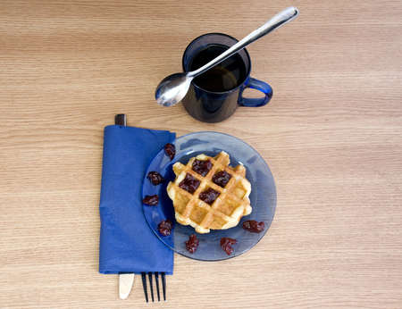 black tea and yummy jam waffle for breakfastの写真素材
