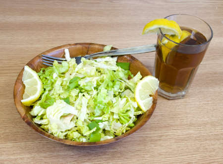 fresh lettuce salad with lemonの写真素材