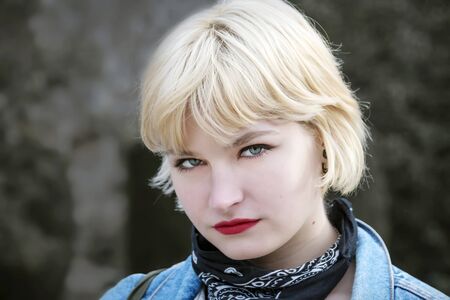 Thoughtful blonde short haired woman portrait
