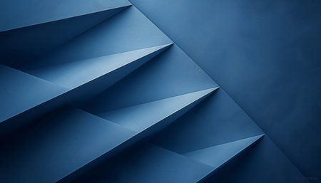 A close-up abstract image of intersecting geometric planes in a deep blue hue.の素材