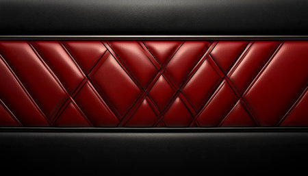 A close-up of a section of red and black leather upholstery with a diamond pattern, typically found in a high-end car interior.の素材