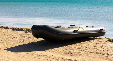 Inflatable boat on seacoastの写真素材