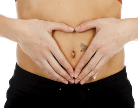 Hands on belly isolated on white background の写真素材