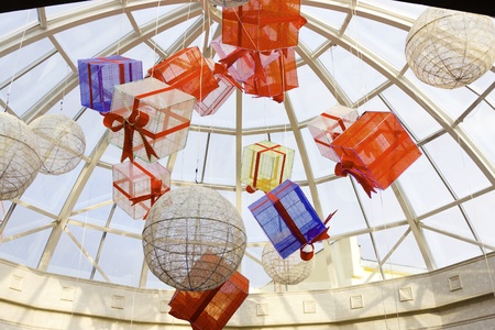 Various gift boxes under the glass roof of the mall