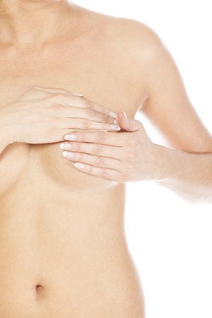 Breast cancer, woman holding her breast, isolated on white backgroundの写真素材