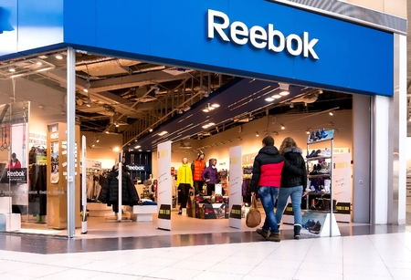 EKATERINBURG, RUSSIA - NOV 24: Shoppers visit Reebok Center in Mega Mall on Nov 24, 2013 in Ekaterinburg, Russia. Mega Mall is one of the biggest malls in Russia and is currently home to over 1000 retail outlets and servicesのeditorial素材