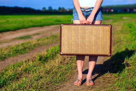 Woman with big old suitcaseの写真素材