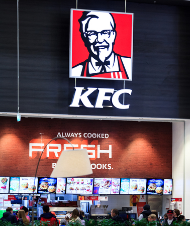 Kentucky Fried Chicken (KFC) Sign. KFC is a fast food restaurant chain that specializes in fried chickenのeditorial素材