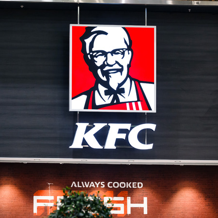 Kentucky Fried Chicken (KFC) Sign. KFC is a fast food restaurant chain that specializes in fried chickenのeditorial素材