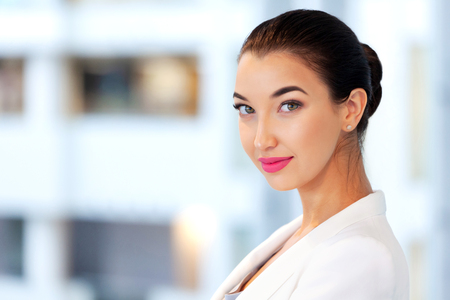 Pretty businesswoman in an officeの写真素材