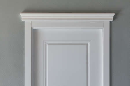 White door and grey wall