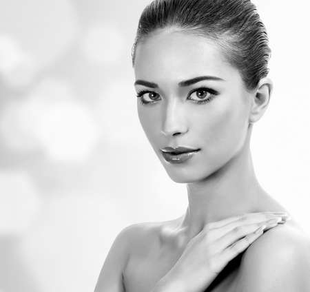 Pretty woman against an abstract background with circles and copyspaceの写真素材