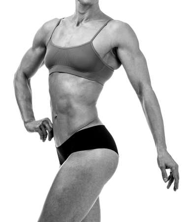 Muscular lady on a white background, isolatedの写真素材