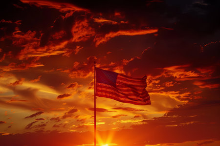 Flag of the United States of America against the background of the setting sunの写真素材