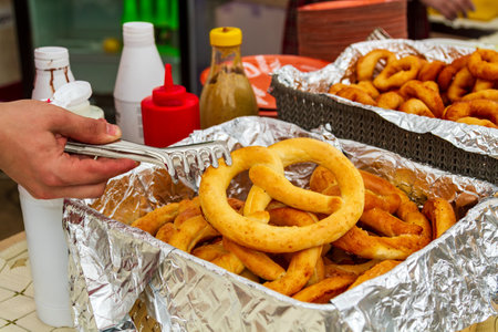 Closeup of bagels and pretzels in a foil boxの写真素材