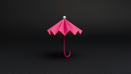 Paper origami umbrella on black background. Minimal concept idea.の素材