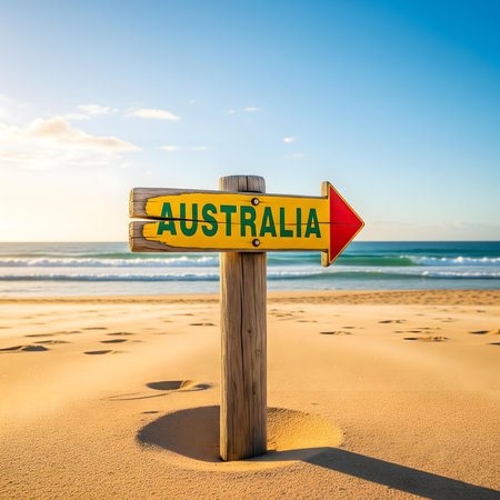 discover australia beach travel sign with ocean horizon and clear blue sky perfect coastal destination for summer holiday adventure relaxation and scenic tourism escapeの素材