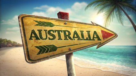 australia travel beach sign with tropical ocean waves palm tree and sandy shore perfect for tourism branding adventure journey and holiday escape visualsの素材