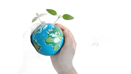 A human hand gently cradles a miniature Earth with a vibrant green plant, symbolizing environmental protection, sustainable growth, and hope for our planet's future. This image represents the importance of nurturing nature and global ecological responsibiの素材