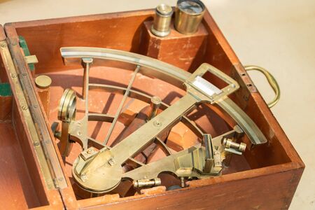 Ancient Sextant and the traditional navy for captain of a boat to make her way to the stars and to the starsの写真素材