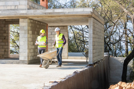 Architects working on construction site on a sunny day in the spring