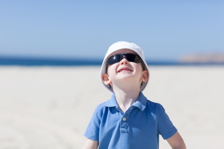 adorable smiling caucasian toddler at the beachの写真素材