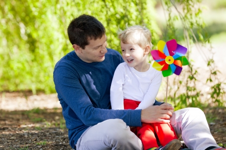 cheerful boy with his father enjoying summer time togetherの写真素材