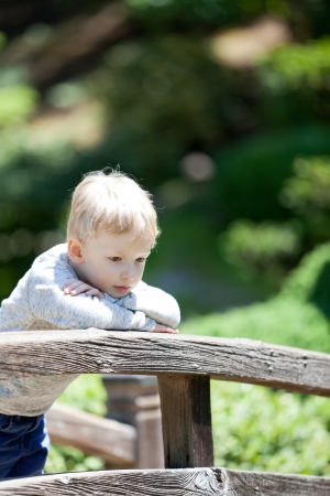 cute sad child outdoorsの写真素材