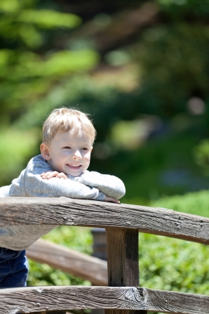 happy smiling boy at the bridgeの写真素材