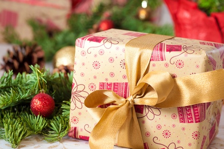 beautiful christmas present nicely wrapped with a bowの写真素材
